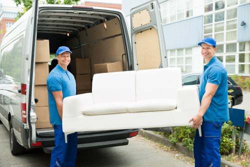 Removal team planning a house move in Catford with boxes and furniture
