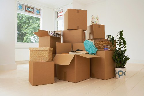 Moving day preparation for Catford residents with boxes and furniture